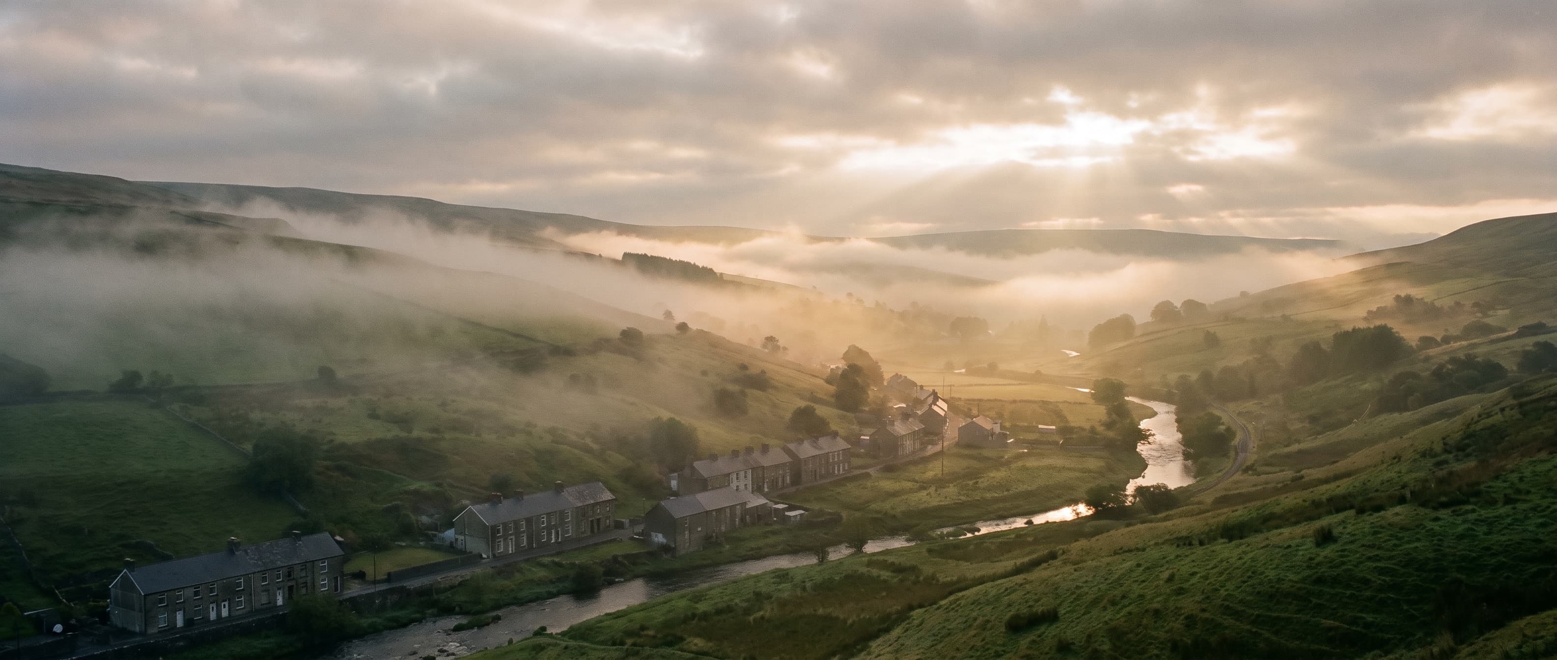 Low cloud drifting over a South Wales valley at dawn
